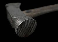 Vintage shoemaker hammer over black background [IBR125188237]