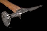Vintage auto bodywork hammer over black background [IBR125188243]