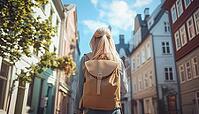 Solo Sightseeing Weekend In Trondheim: Young Blonde Woman Explores Scandinavian Architecture And Outdoor Life With Backpack In Charming Norwegian City, AI generated [IBR125200675]