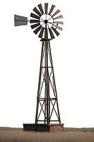 A tall, metal windmill stands in isolation against a white background, evoking a sense of simplicity and rural serenity, AI generated [IBR125203212]
