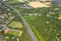 Aerial view, A2 motorway, possible and planned route for regional railway between Kamen and Bergkamen, Jahnstadion, soccer player on the side square, railway infrastructure, road traffic and truck traffic, Kamen, Ruhr area, North Rhine-Westphalia, Germany [IBR113322292]