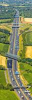 Aerial view, A2 motorway near Kamener Kreuz motorway junction, highway A1 and motorway A2, road traffic and truck traffic, Kamen, railway bridge, bridges, Ruhr area, North Rhine-Westphalia, Germany, motorway, BAB, motorway junction, air suspension, overvi [IBR113322338]