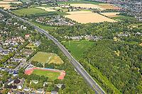 Aerial view, A2 motorway, possible and planned route for regional railway between Kamen and Bergkamen, Jahnstadion, soccer player on the side square, railway infrastructure, road traffic and truck traffic, Kamen, Ruhr area, North Rhine-Westphalia, Germany [IBR113322370]