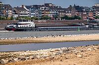 Rhine near Emmerich, extreme low water, Rhine level at 5 cm, downward trend, cargo ships sometimes only have to travel with 30 percent of the usual load, backdrop of the Emmerich waterfront, North Rhine-Westphalia, Germany [IBR113322462]