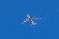 Airbus A380 jet passenger aircraft of Emirates airlines flying in a blue sky, England, United Kingdom [IBR125204163]