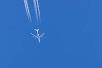 Boeing 747 jumbo jet passenger aircraft of Lufthansa airlines flying in a blue sky with contrails or vapour trails behind in the atmosphere, England, United Kingdom [IBR125204168]