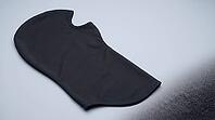 Firefighter protective hood fabric appearing ordinary with a macro detail revealing subtle fiber roughening from abrasion stress, protective gear study, studio shot, AI generated [IBR125211483]