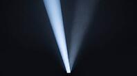 Abstract light beam splitting into two diverging paths, one bright one fading, dark background, studio shot, AI generated [IBR125211523]