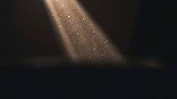 Extreme close-up of a light beam with suspended particulate matter glowing against a dark surround, indoor smoke contamination visualization, AI generated [IBR125211548]
