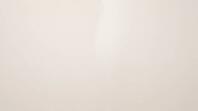 Painted wall surface with a faint sheen transition where invisible chemical residue has been absorbed over time, indoor contamination concept, studio shot, AI generated [IBR125211550]