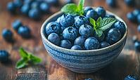 Fresh Blueberries In A Rustic Wooden Bowl: Delicious And Nutritious Organic Seasonal Fruit With Mint Leaf On A Close-Up Shot, AI generated [IBR125229872]