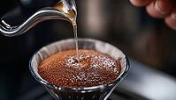 Close-Up Shot Of A Hand Demonstrating The Drip Coffee Or V60 Method, Pouring Hot Water From A Kettle Onto Ground Coffee In A Funnel For Homemade Coffee, AI generated [IBR125229907]