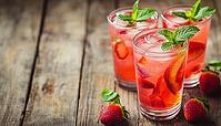Refreshing Pink Lemonade: Strawberry Soda And Fresh Mint Served In Glasses On A Rustic Wooden Table. A Summertime Treat, AI generated [IBR125229908]