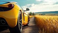 Luxury Sports Car Parked Alongside A Road With A Stunning View Of A Field Of Golden Wheat. A Perfect Scene, AI generated [IBR125229941]