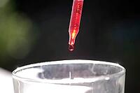Pipette, drop, close-up, red, 0, 50 ml, With a graduated pipette, red liquid is dosed into a glass [IBR125237482]