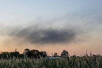 After a flat roof fire on a large construction site, a massive cloud of dark smoke rises above Stuttgart's Rot district and is visible from afar. The heavy smoke development led to numerous emergency calls from the urban area. Police used a helicopter to  [IBR125237554]