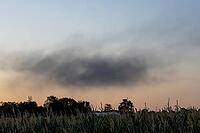 After a flat roof fire on a large construction site, a massive cloud of dark smoke rises above Stuttgart's Rot district and is visible from afar. The heavy smoke development led to numerous emergency calls from the urban area. Police used a helicopter to  [IBR125237556]