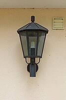Traditional black outdoor wall lantern designed for exterior house walls and entrance lighting, Finland [IBR125242393]
