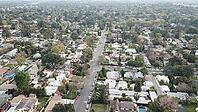 Aerial view of a residential neighborhood with houses, trees, and streets under a cloudy sky, Alta Dena, California, USA [IBR125242398]