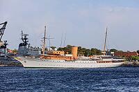 Royal yacht Kongeskibet Dannebrog in front of Copenhagen Naval Station on Nyholm, seen from Langelinie, Copenhagen København, Zealand Sjælland, Denmark, Baltic Sea [IBR125242415]