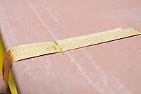 Fastening decorative ribbons to decorative clay panels with a stapler [IBR125242436]