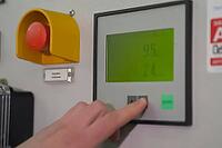 Finger on the parameter value adjustment button on the control panel [IBR125242448]