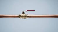 Ordinary copper pipe with a closed shutoff valve, calm exterior hiding the violent pressure transient of water hammer, studio shot, AI generated [IBR125242473]