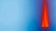 Abstract color-field gradient transitioning from calm blue steady flow to an intense red pressure spike, water hammer visualization, studio shot, AI generated [IBR125242485]