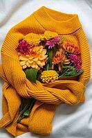 Creative arrangement in yellow sweater Selective focus Bush of autumnal orange red chrysanthemums and violet dahlia hydrangea. Fall garden beautiful flowers bouquet background. Blooming blossom thanksgiving day at the florist shop [IBR125261573]