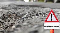 Road sign warning against damaged roadway [IBR125261576]