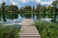 A view of a lake with a jetty near Allstedt in Saxony-Anhalt [IBR125261586]