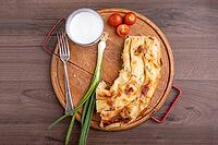 Borek or Burek pie with feta cheese aranged on wooden table [IBR125261600]