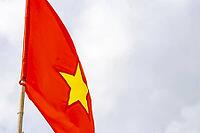 Vietnam Vietnamese flag with dark gray cloudy sky in Patong Beach Kathu District Phuket Island Province Southern Thailand in Southeast Asia [IBR125280301]