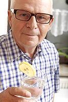 Senior with water glass [IBR125280307]