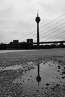 View of the Rhine with very low water, behind it the television tower, reflection, black and white, drought, lack of water, Düsseldorf, Germany [IBR125304602]