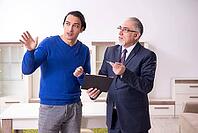 Male real estate agent and male client in the apartment [IBR125304606]