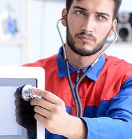 The young mechanic repairs and repairs the microwave oven [IBR125304618]