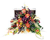 A colorful floral arrangement of roses, lilies, freesia and irises in a wooden chest, isolated on white background [IBR125304622]
