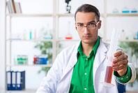 The young male chemistry teacher in the laboratory [IBR125304684]