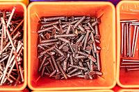 Steel nails used in carpentry. Accessories for mounting and connecting in boxes. Light background [IBR125324123]