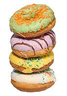 Stack of four colorful glazed donuts with assorted sprinkles and toppings, isolated background [IBR125331120]
