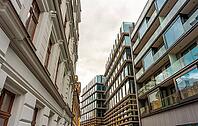 Architectural Contrast Old Facade Beside Modern Building [IBR125331172]