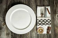 Plate with cutlery and napkin, creative vintage tableware, top view [IBR125331196]