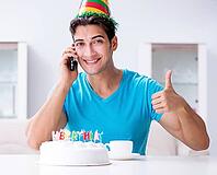 The young man is celebrating his birthday alone at home [IBR125331206]