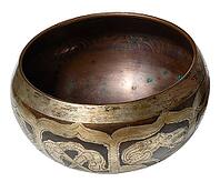 Copper singing bowl for meditation and relaxation on isolated background [IBR125344242]