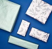 Various boxes packed in paper on a blue background, holiday gifts, top view [IBR125344319]