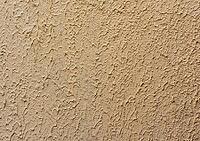 Fragment of beige wall with decorative plaster of waves, full frame [IBR125344320]
