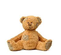 Brown teddy bear sits on a white background, toy with patches [IBR125344323]
