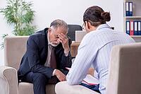 The old man visits the young male doctor, psychologist [IBR125344327]