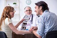 The young couple visits an old male doctor [IBR125363564]